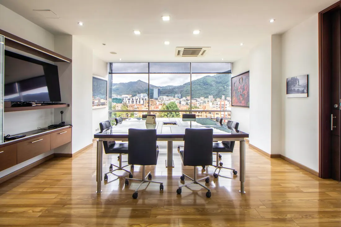 Conference room set for the morning meeting, table polished