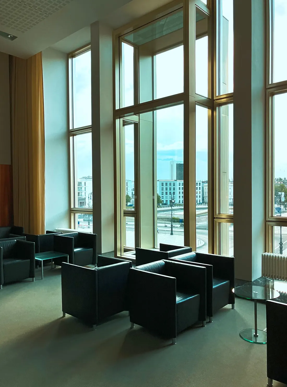 Shared residential lobby with seating and glazing kept clean