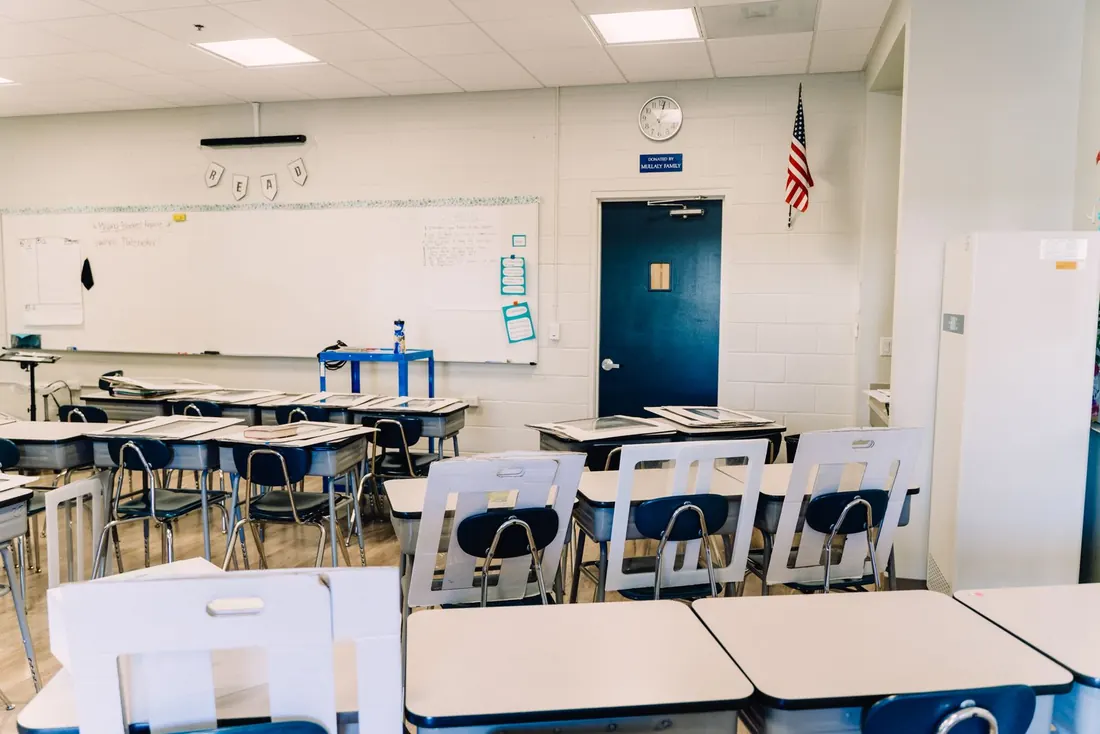 Classroom with desks squared up before the first bell