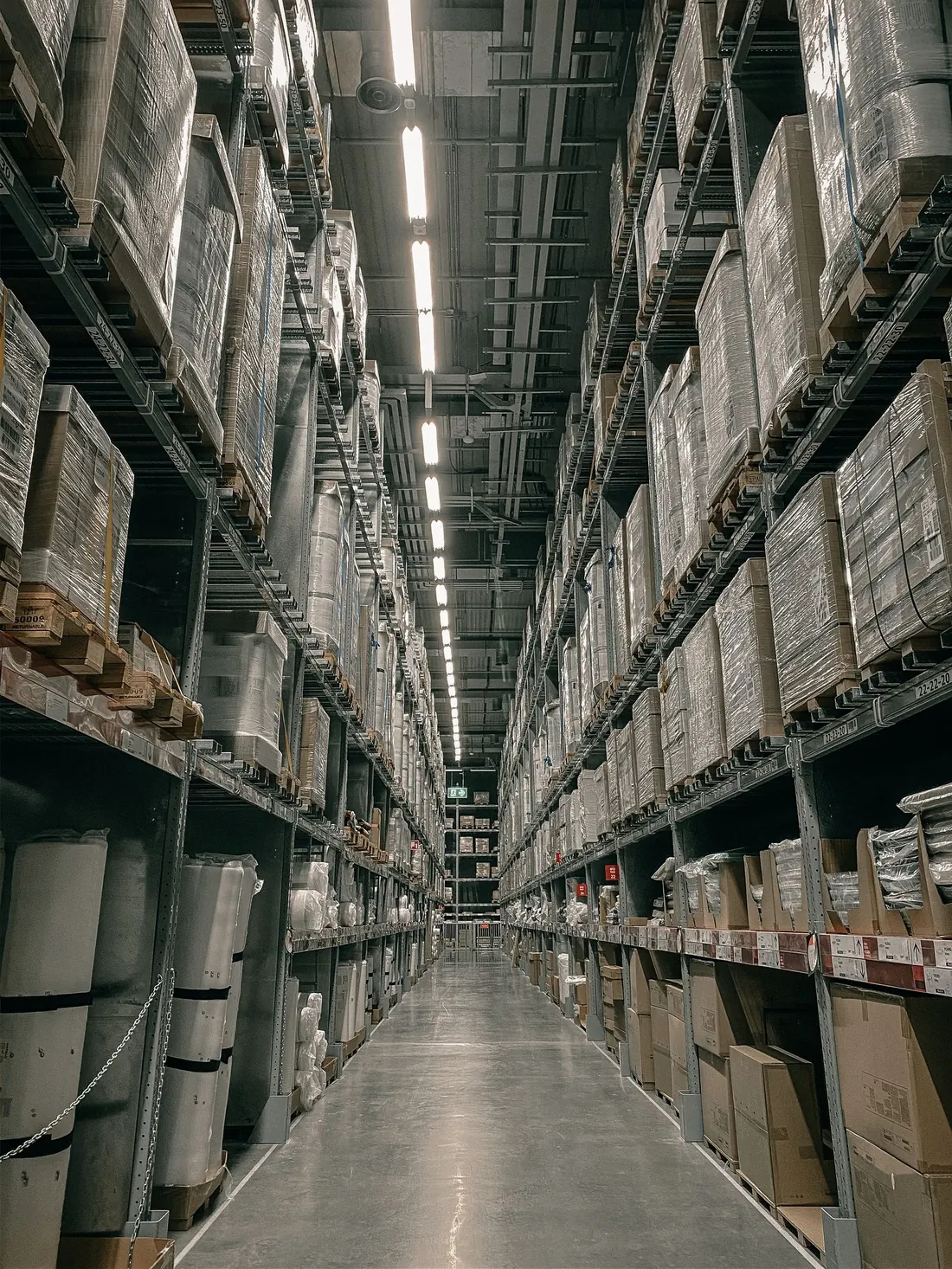 Racked warehouse aisle with the slab swept end to end