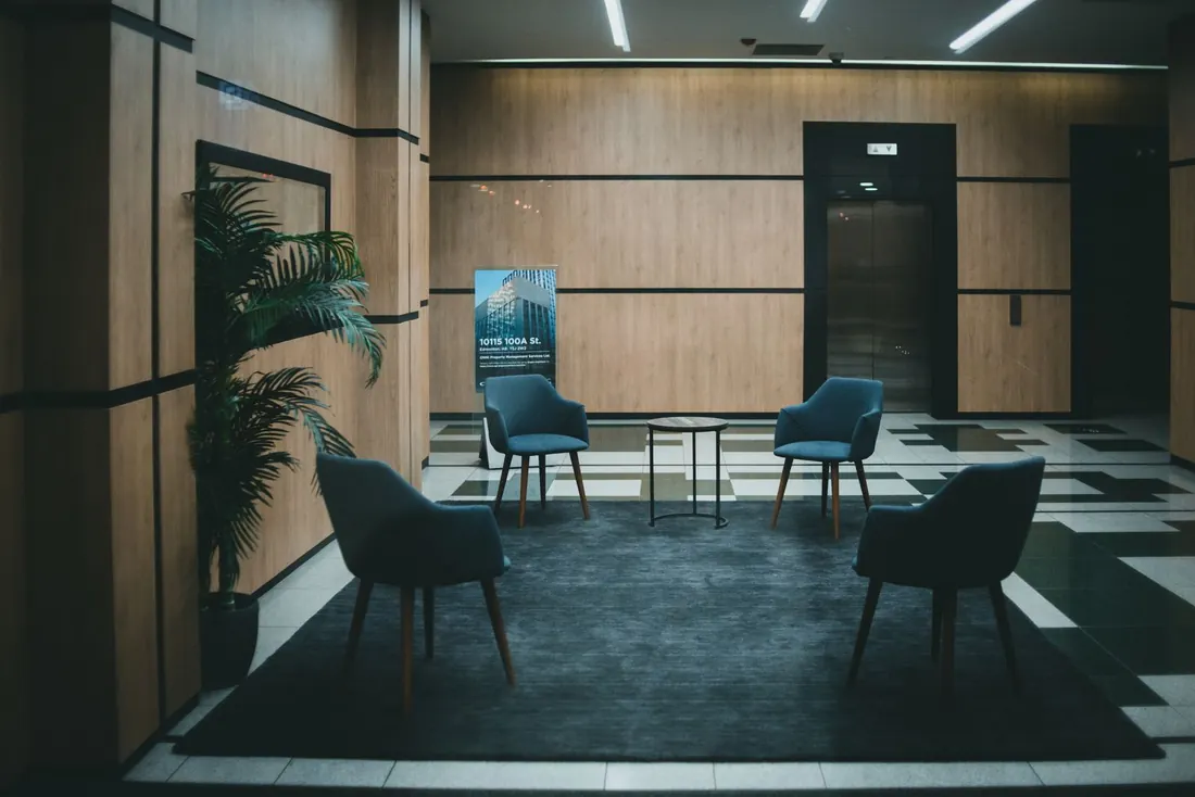 Reception seating in a quiet office lobby, floor clear