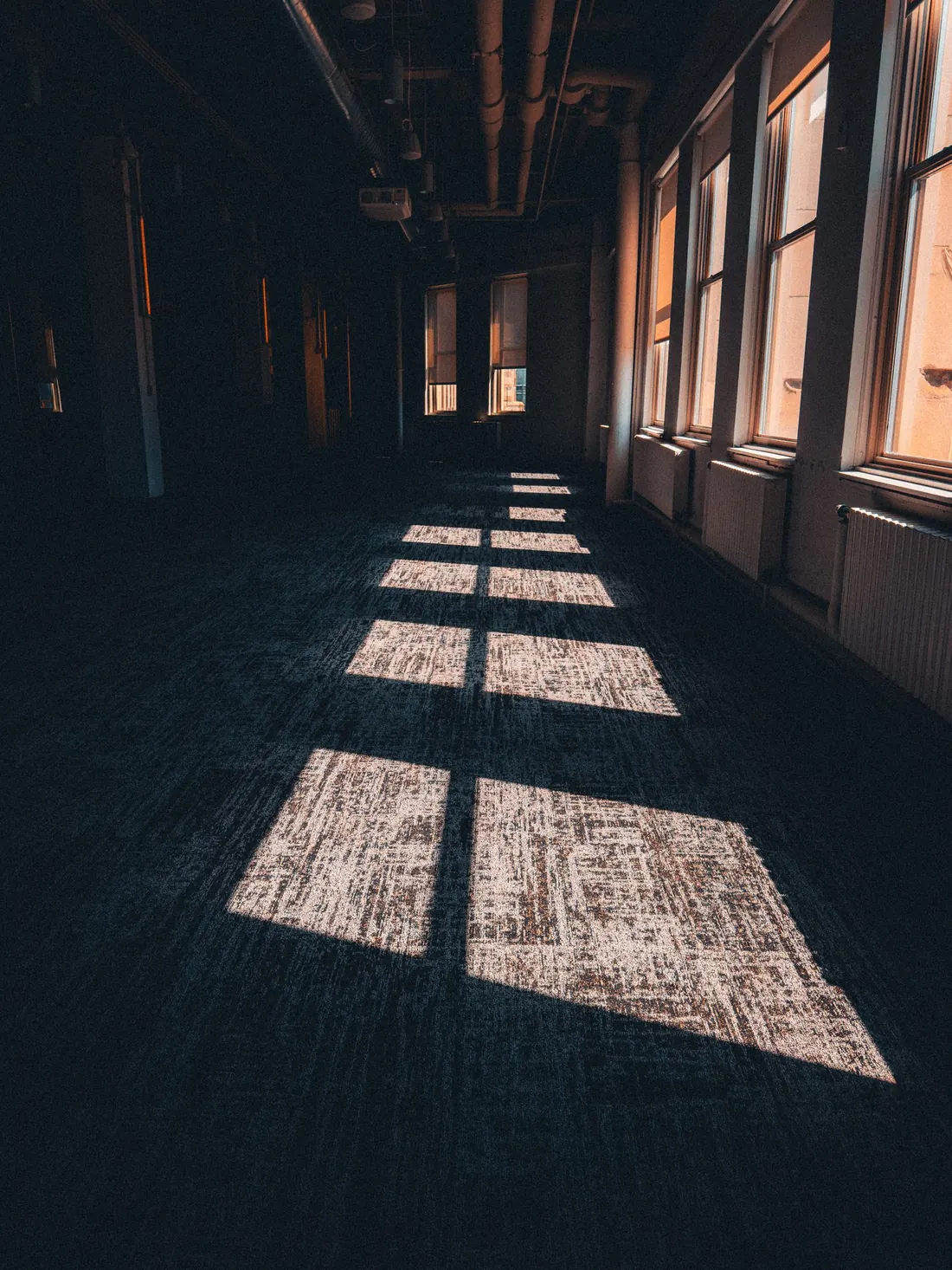 Hard floor running the length of a corridor, finish still even